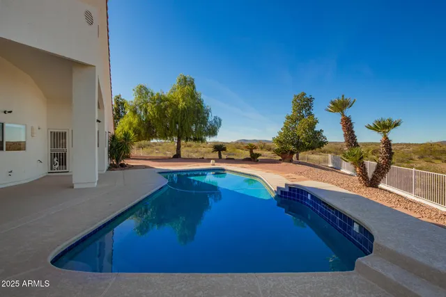 a spacious bedroom with a bed and window