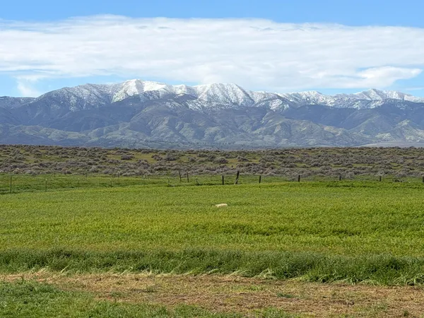a view of an ocean and mountain