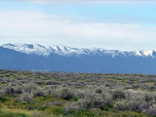 a view of a house with a mountain