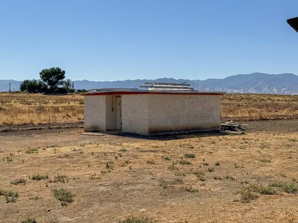 a view of a snow with a mountain in the background