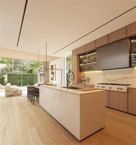 a kitchen with stainless steel appliances granite countertop a sink and wooden cabinets