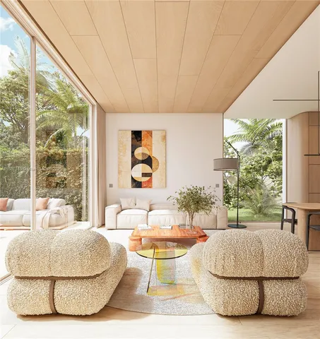 a living room with a large window and a table