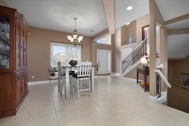 a dining room with furniture and window