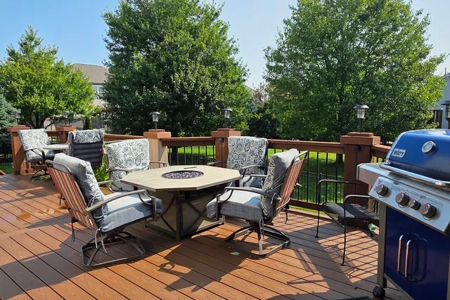 a view of a patio with couple of chairs