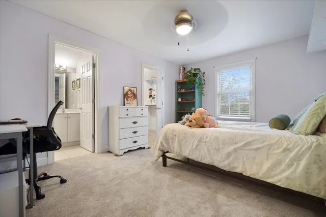 a room with gym equipment and wooden floor