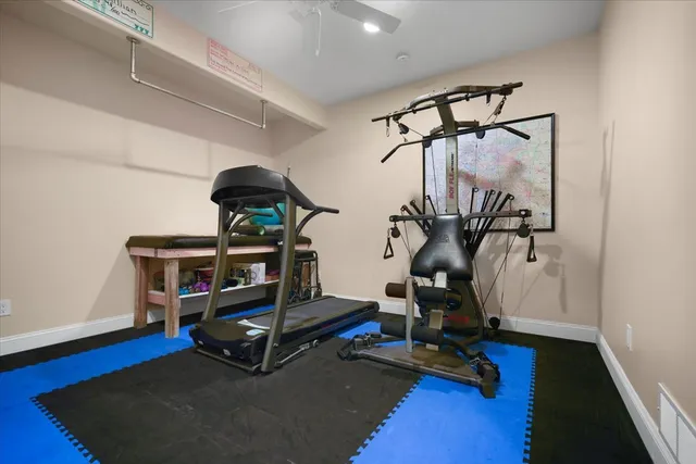 a front view of a house with a flower garden