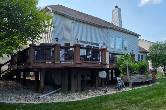 a house view with a seating space and garden