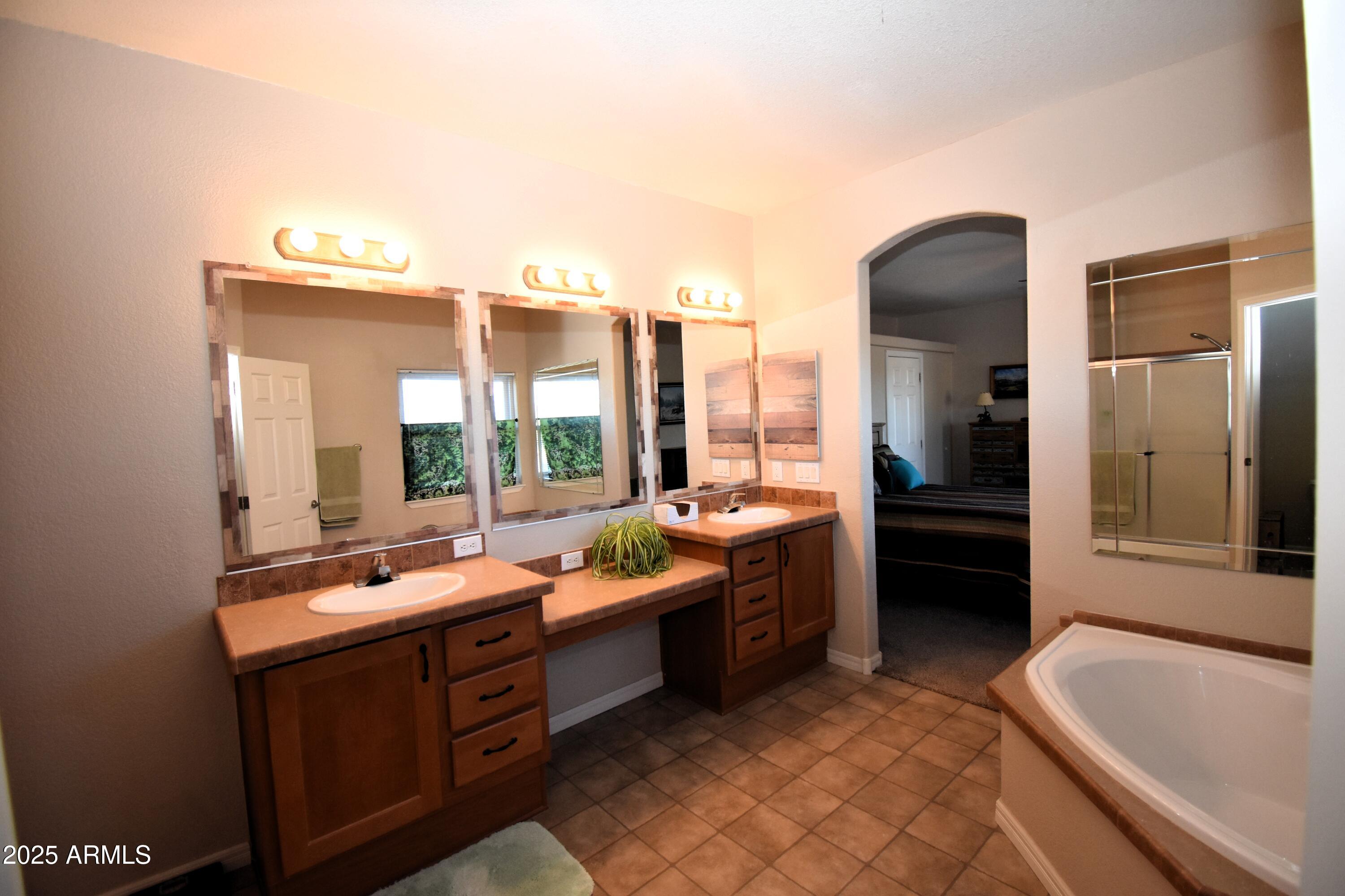 4665 Lazy Lariat Lane Rimrock, AZ 86335 - Photo 11 of 29 a room with sink furniture and a large window