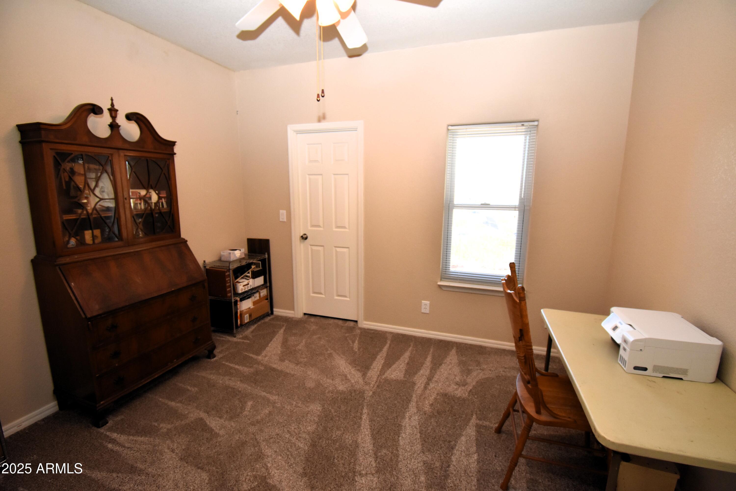 4665 Lazy Lariat Lane Rimrock, AZ 86335 - Photo 12 of 29 a view of a workspace with furniture and a window