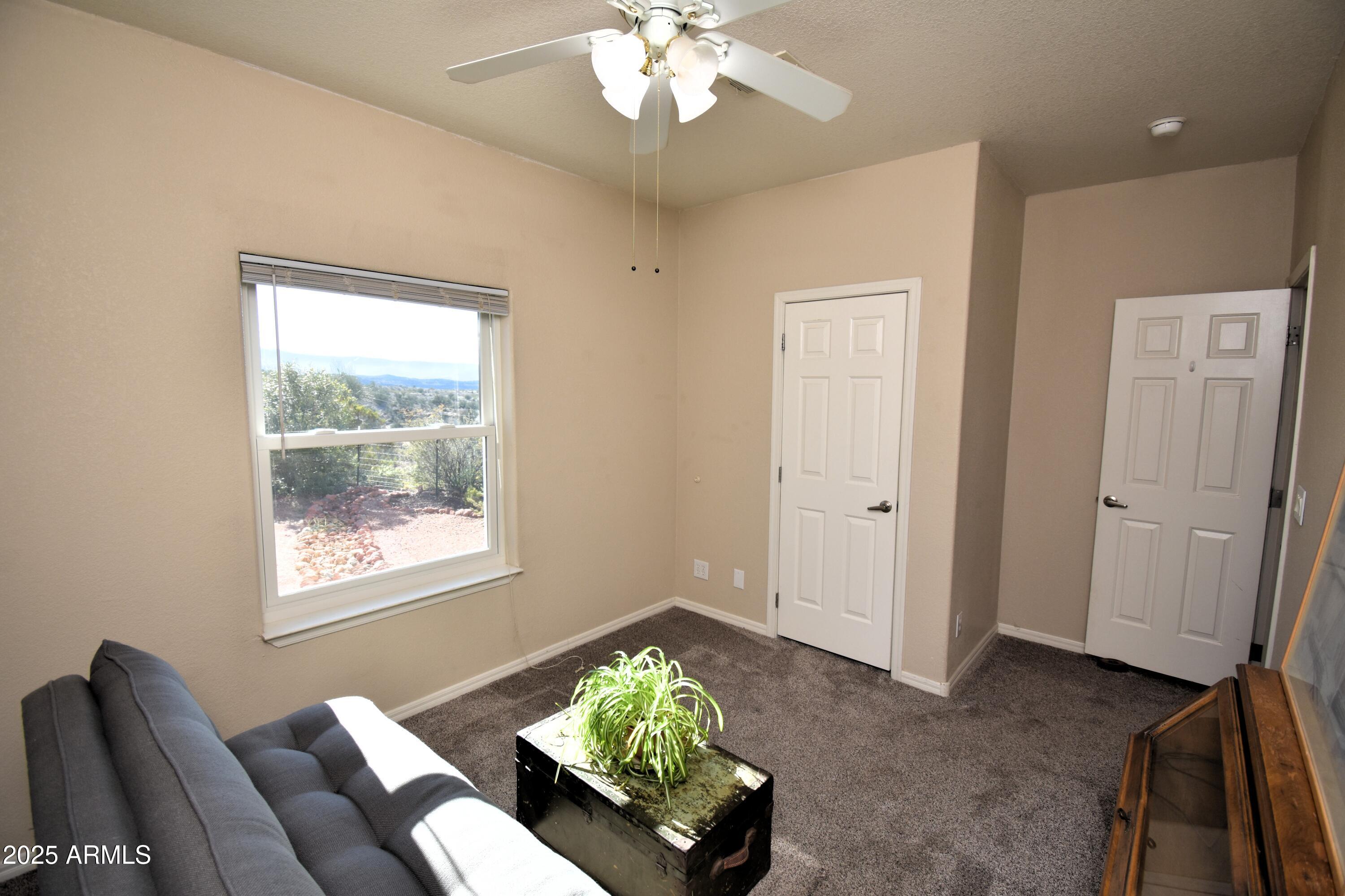 4665 Lazy Lariat Lane Rimrock, AZ 86335 - Photo 13 of 29 a living room with furniture and a window