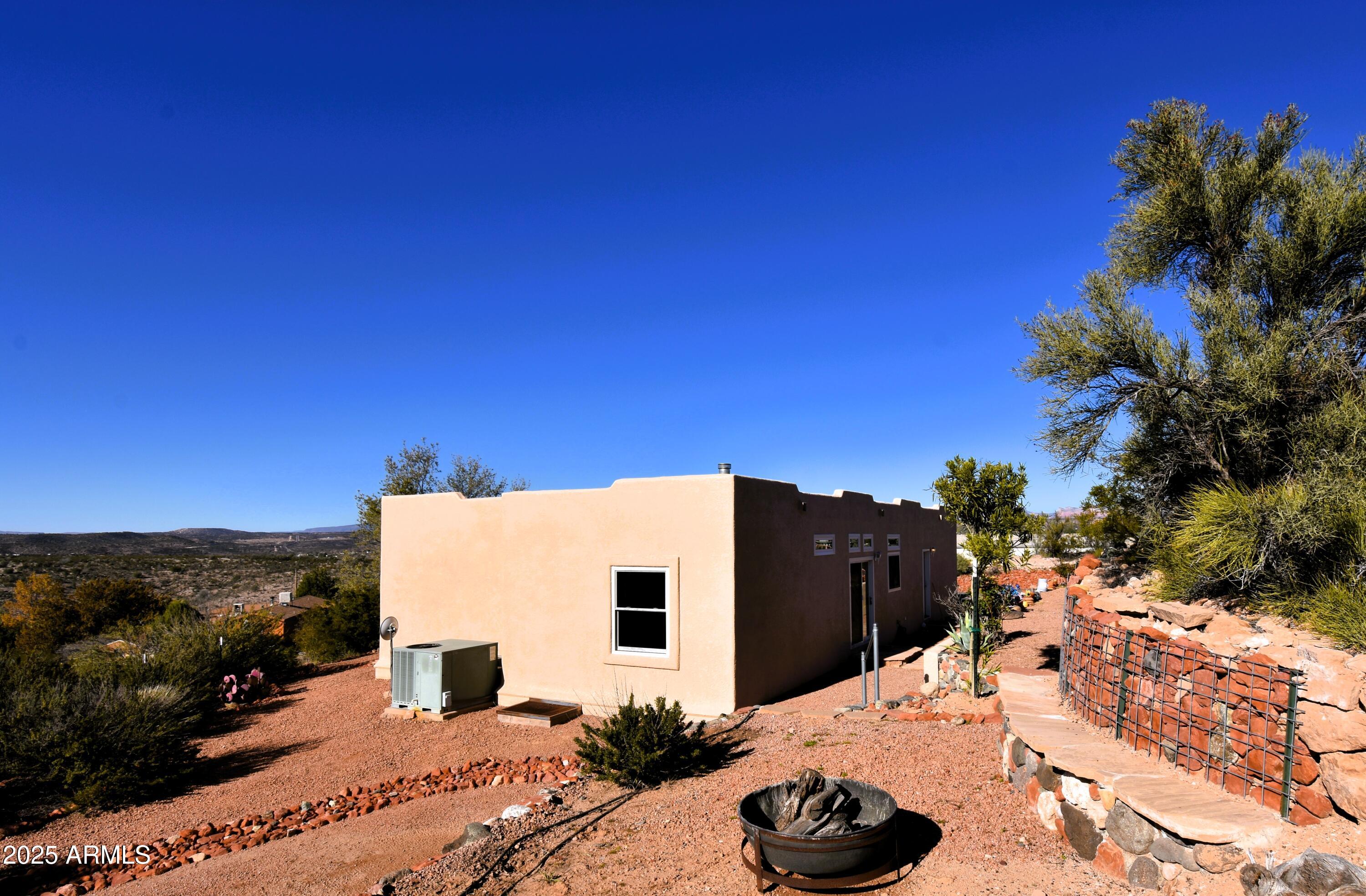 4665 Lazy Lariat Lane Rimrock, AZ 86335 - Photo 17 of 29 a view of a house with a backyard