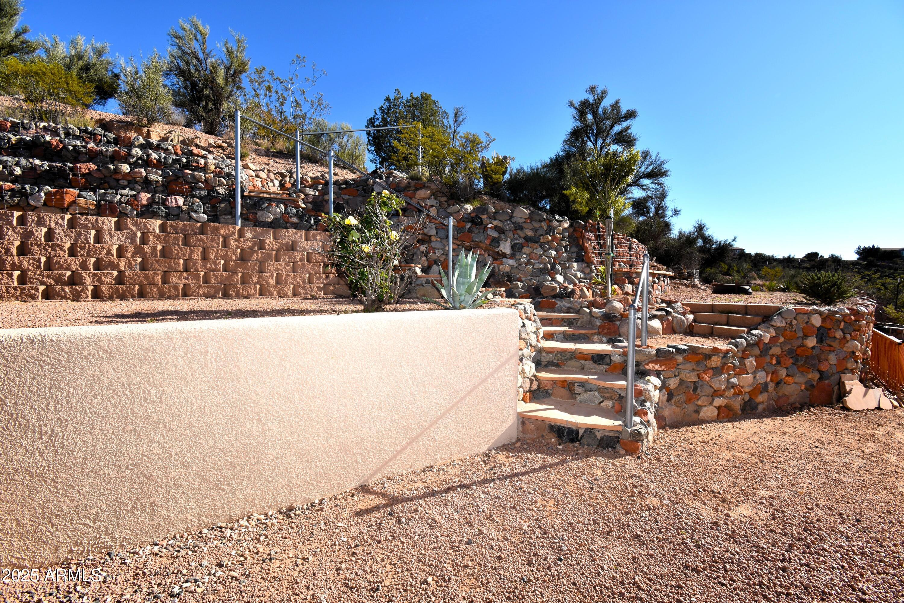 4665 Lazy Lariat Lane Rimrock, AZ 86335 - Photo 18 of 29 a view of a wooden house with a bench