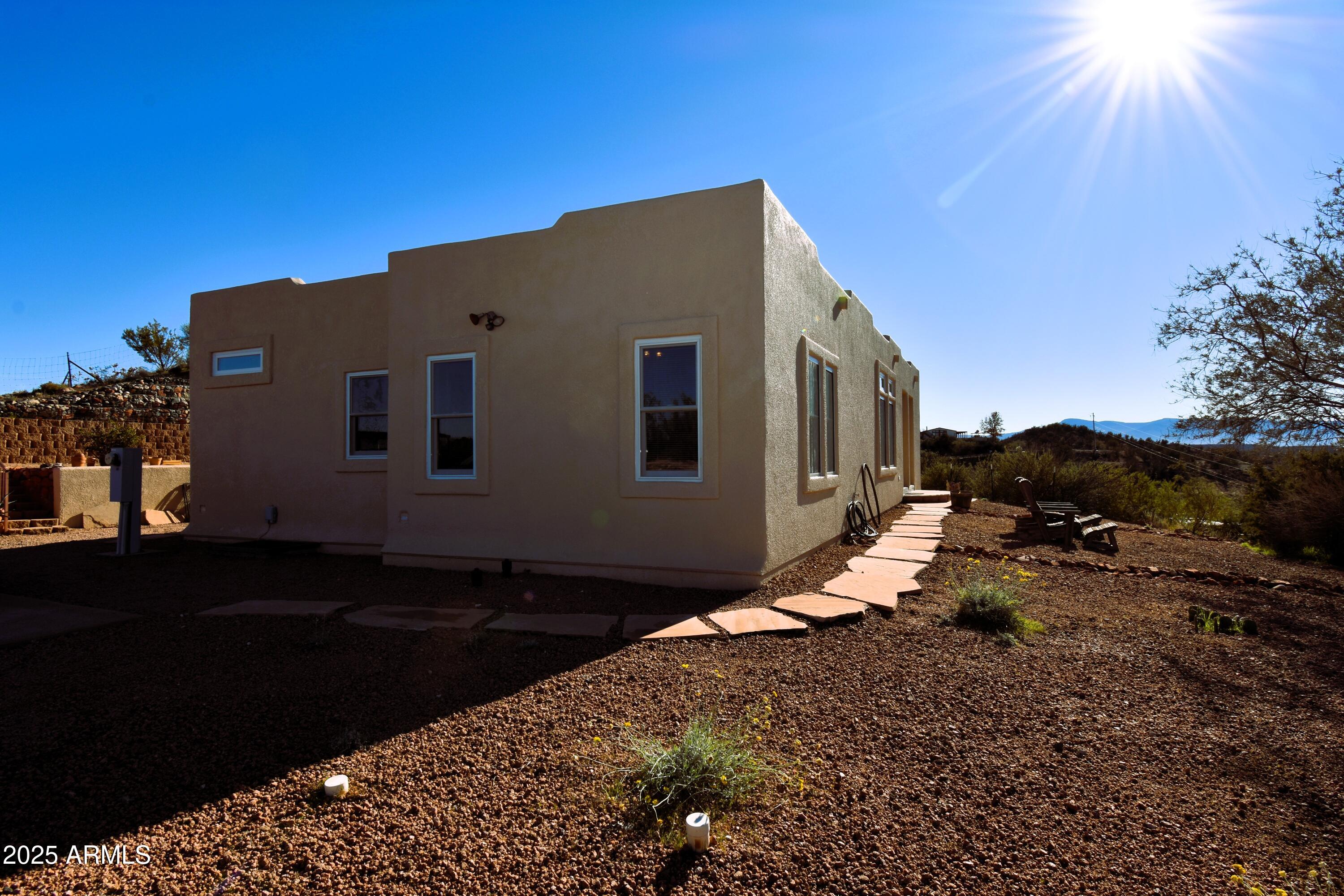 4665 Lazy Lariat Lane Rimrock, AZ 86335 - Photo 23 of 29 a backyard of a house with yard fire pit and outdoor seating