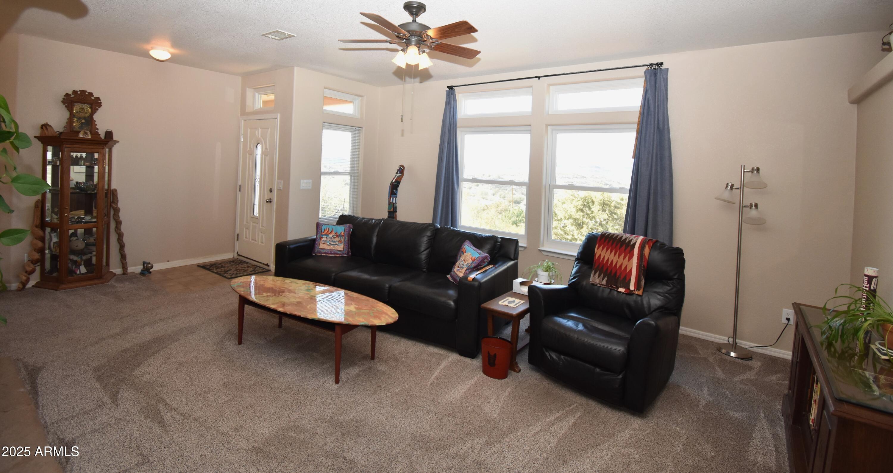 4665 Lazy Lariat Lane Rimrock, AZ 86335 - Photo 3 of 29 a living room with furniture and a large window