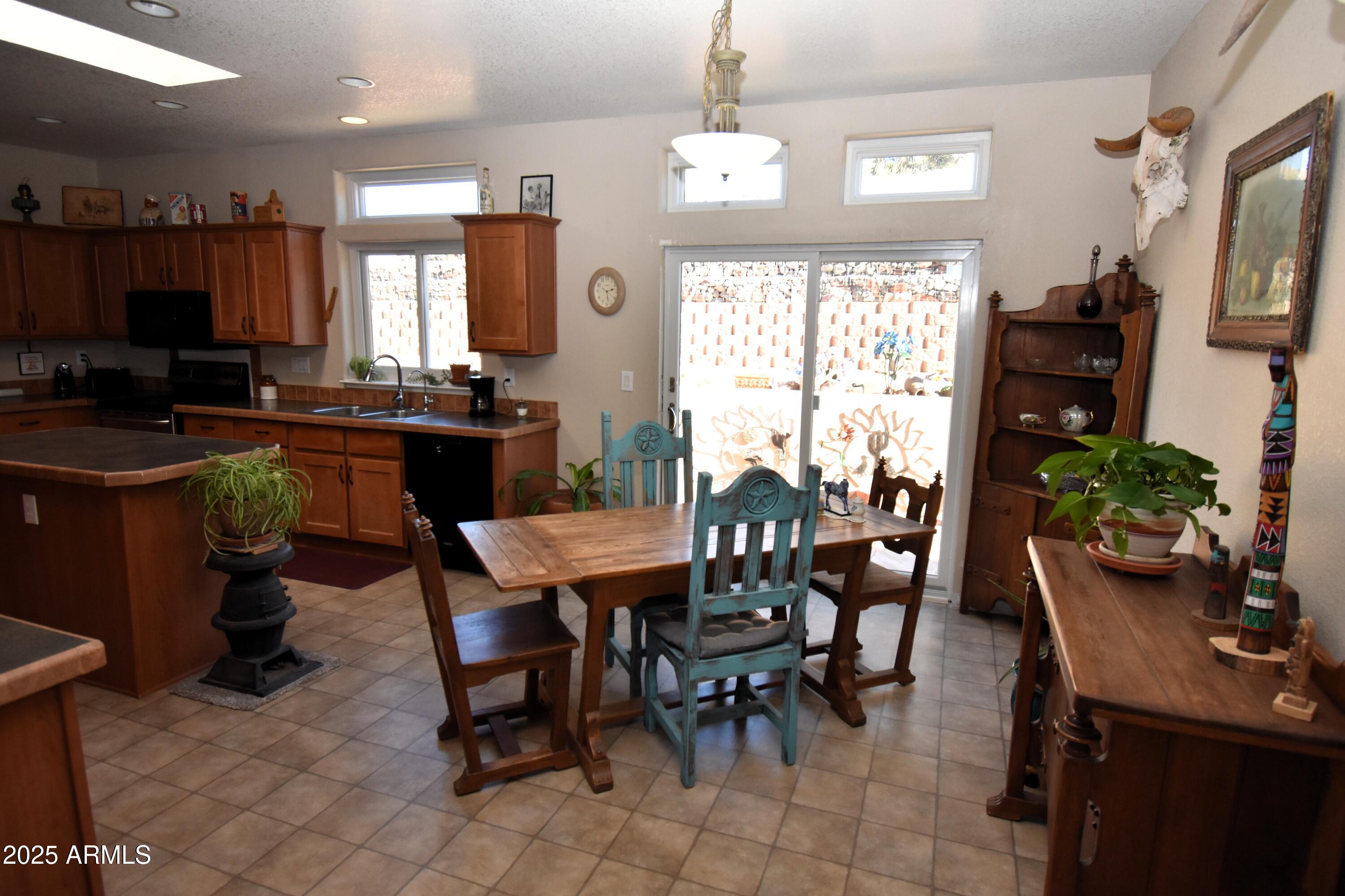 4665 Lazy Lariat Lane Rimrock, AZ 86335 - Photo 7 of 29 a view of a dining room with furniture window and wooden floor