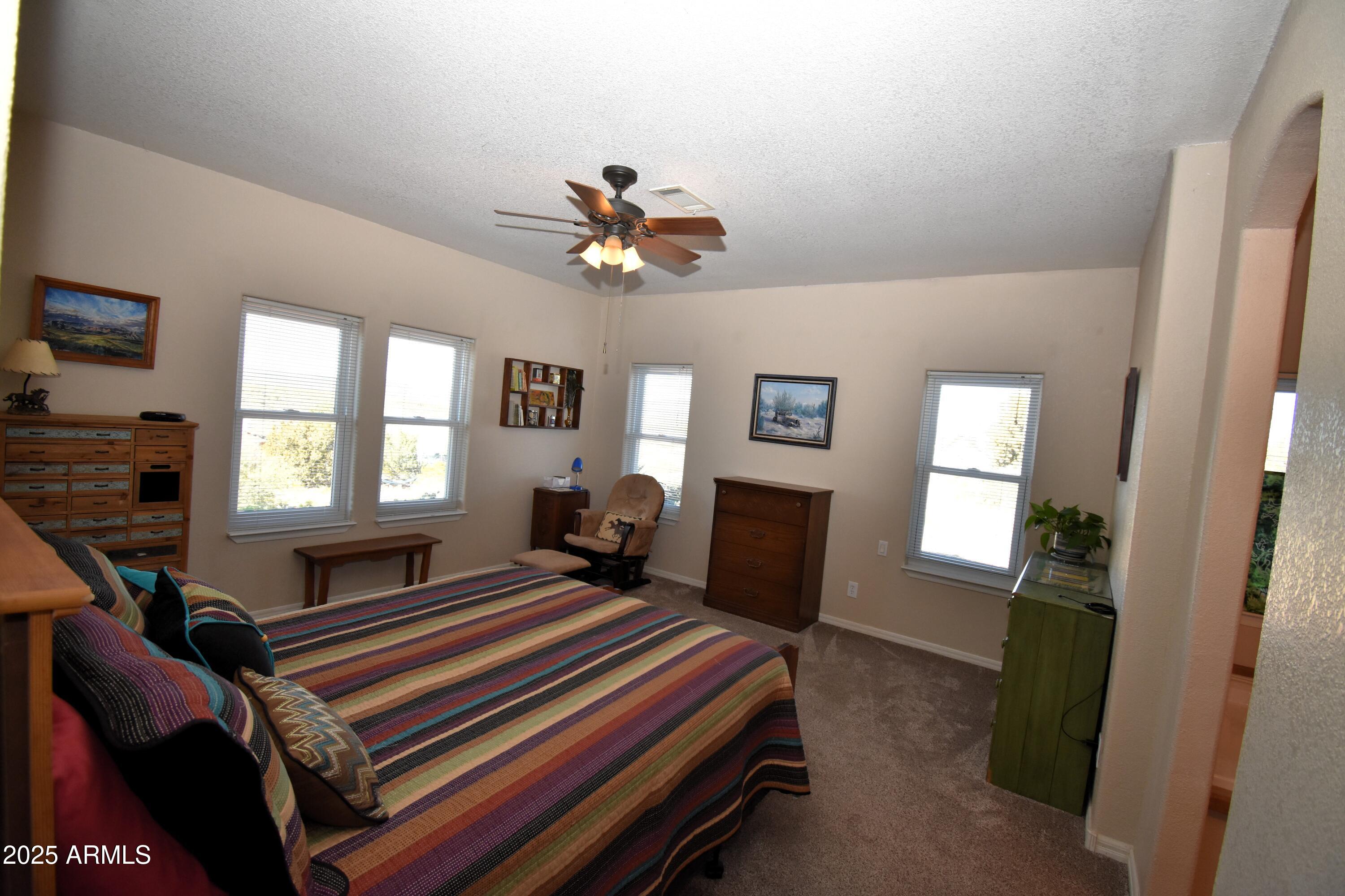 4665 Lazy Lariat Lane Rimrock, AZ 86335 - Photo 9 of 29 a bedroom with furniture and a window