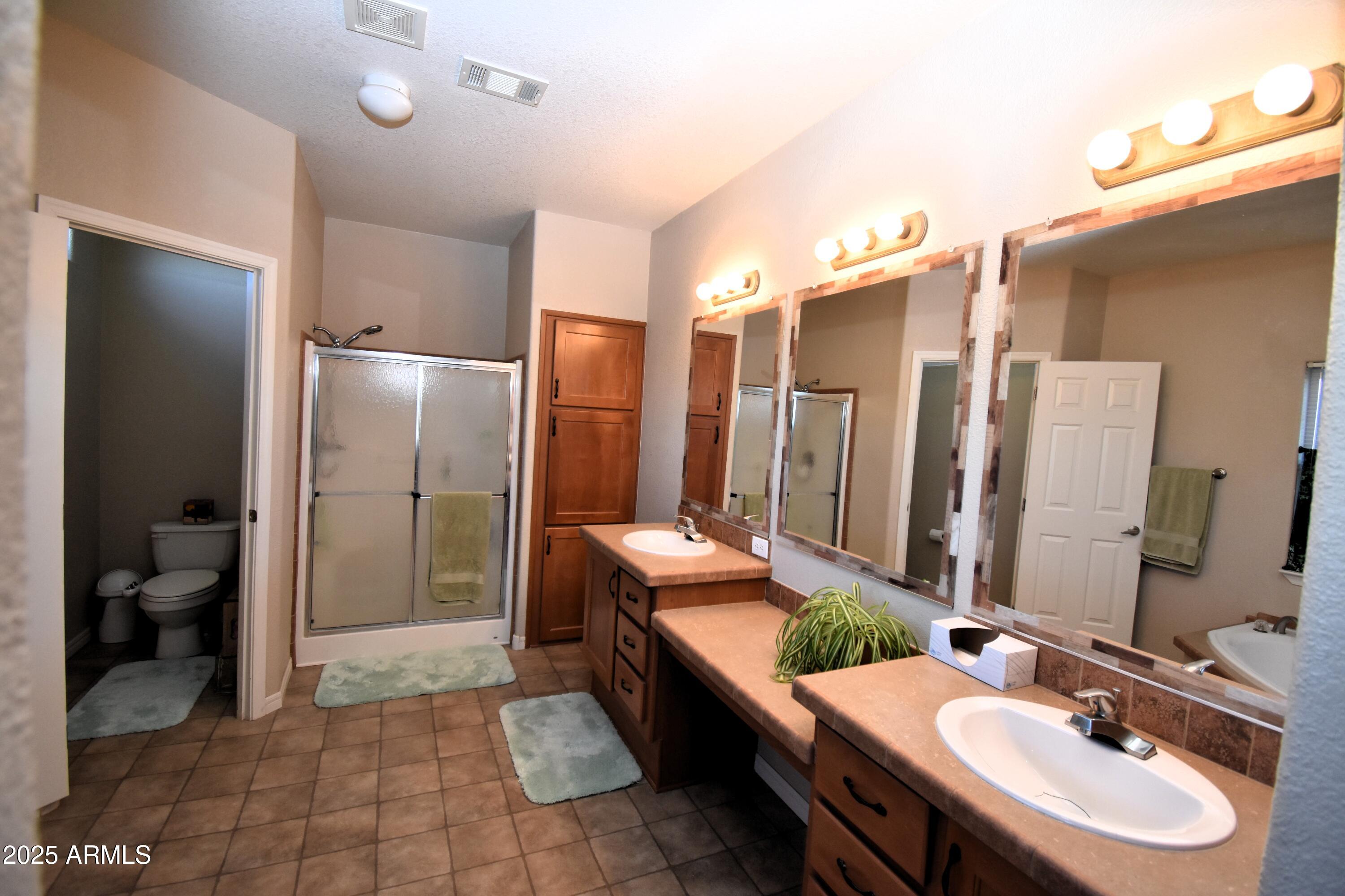 4665 Lazy Lariat Lane Rimrock, AZ 86335 - Photo 10 of 29 a bathroom with a tub sink and toilet