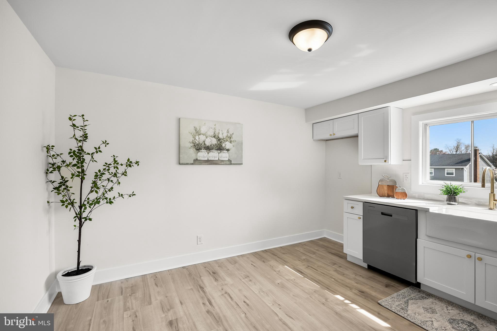 10 Cobblestone Road Cherry Hill, NJ 08003 - Photo 10 of 15 a view of a room with wooden floor and potted plant