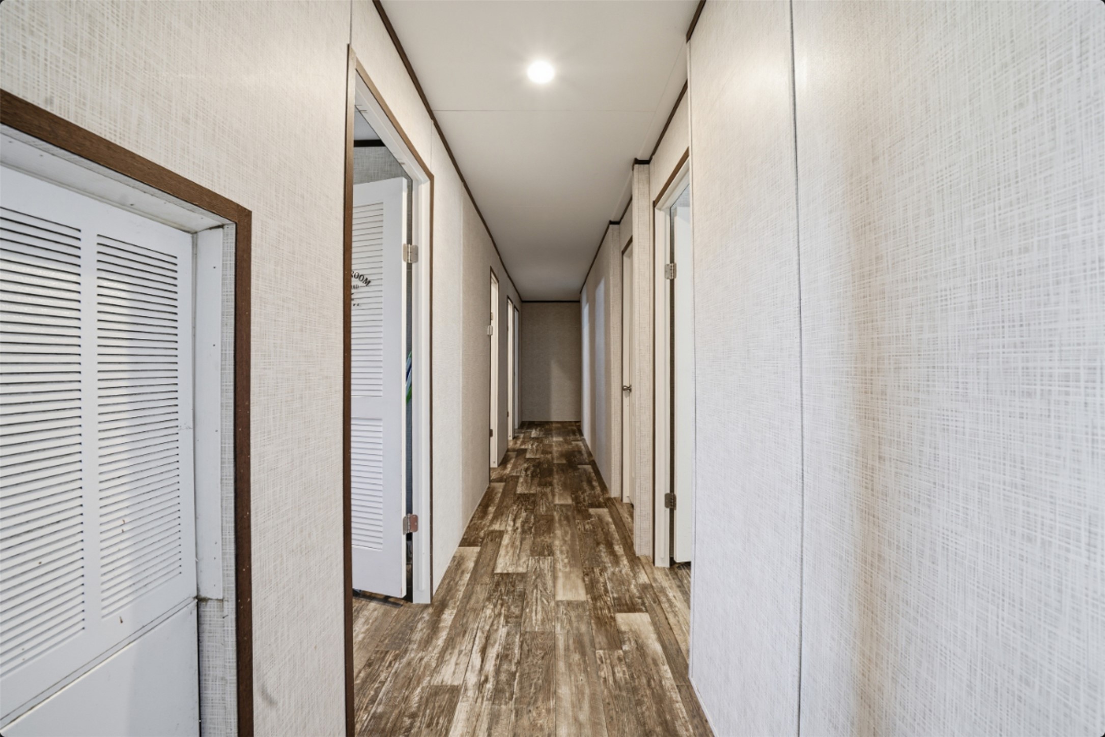 2493 County Road 464 Elgin, TX 78621 - Photo 15 of 40 a view of a hallway with wooden floor and staircase