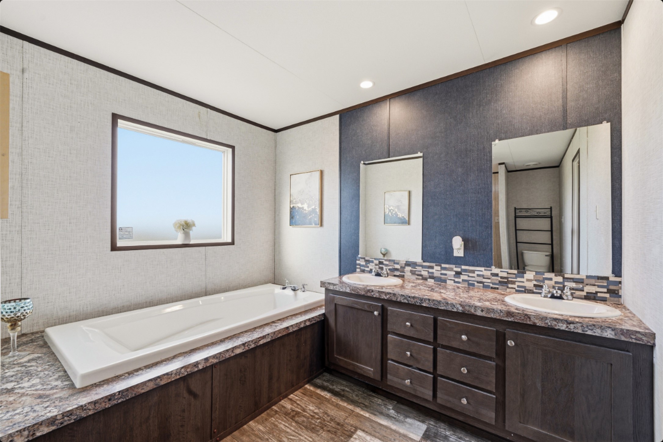 2493 County Road 464 Elgin, TX 78621 - Photo 22 of 40 a spacious bathroom with a double vanity sink and a mirror