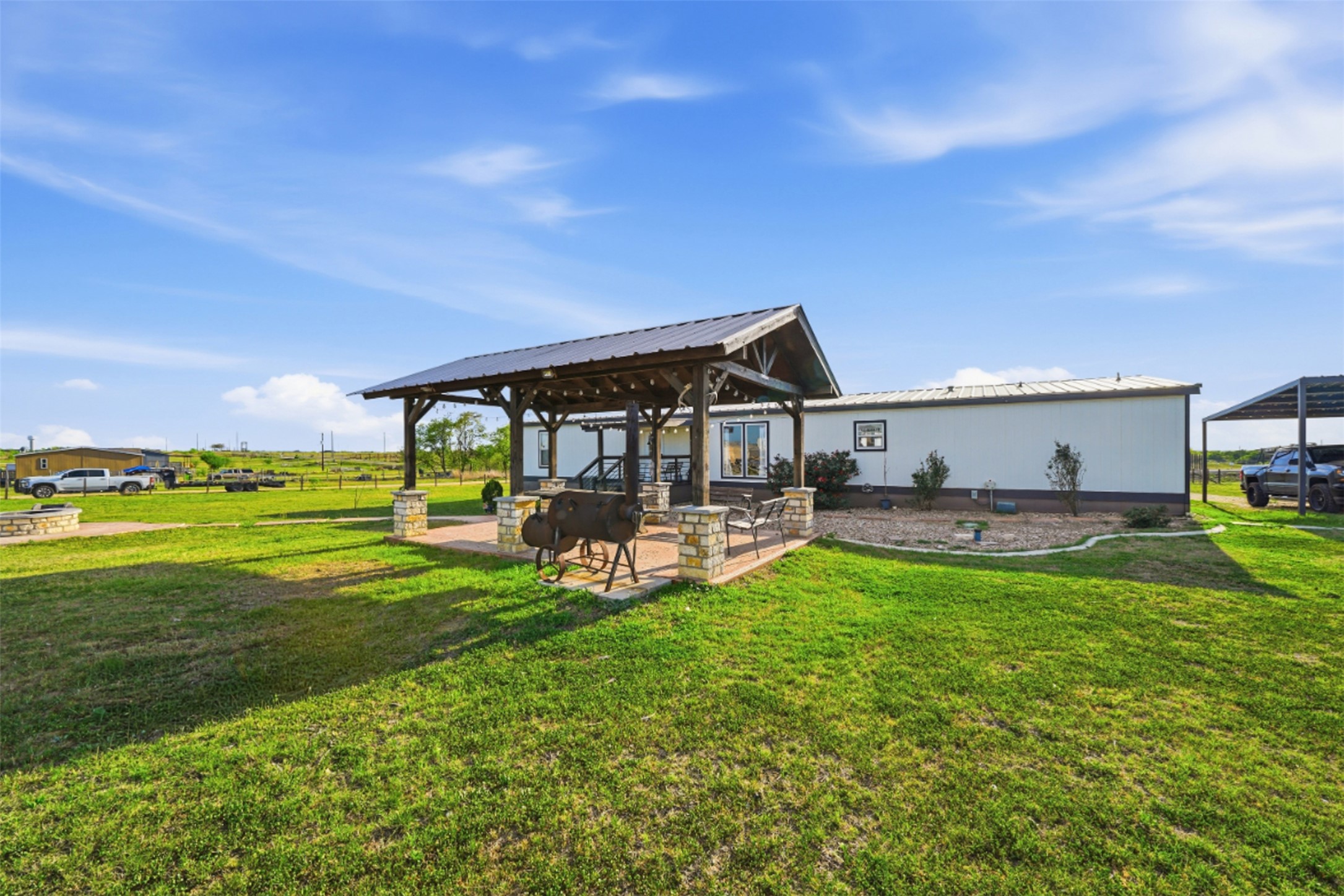 2493 County Road 464 Elgin, TX 78621 - Photo 29 of 40 a view of a house with a yard porch and sitting area