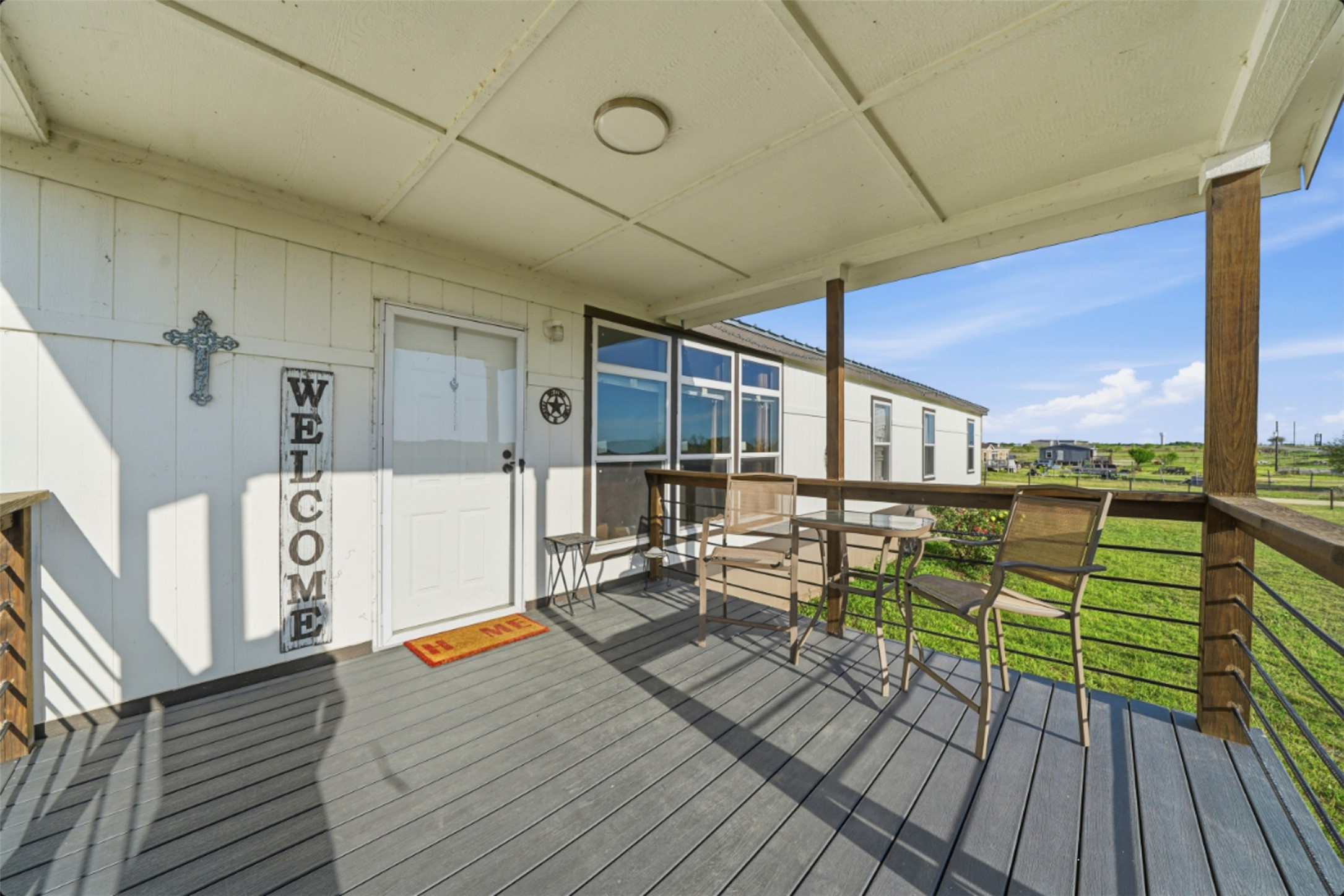 2493 County Road 464 Elgin, TX 78621 - Photo 5 of 40 a view of a deck with wooden floor and bench