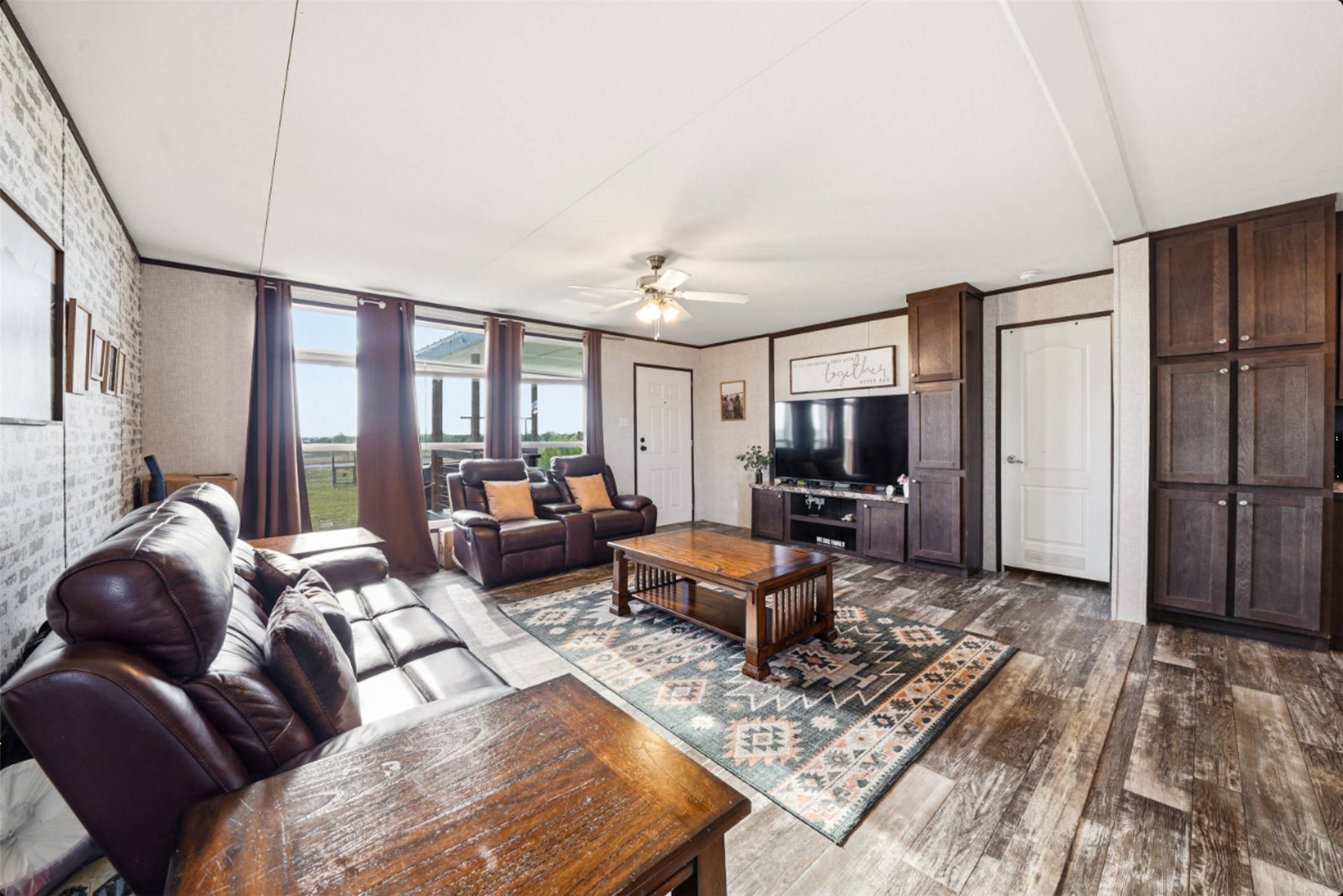 2493 County Road 464 Elgin, TX 78621 - Photo 7 of 40 a living room with furniture a large window and a rug