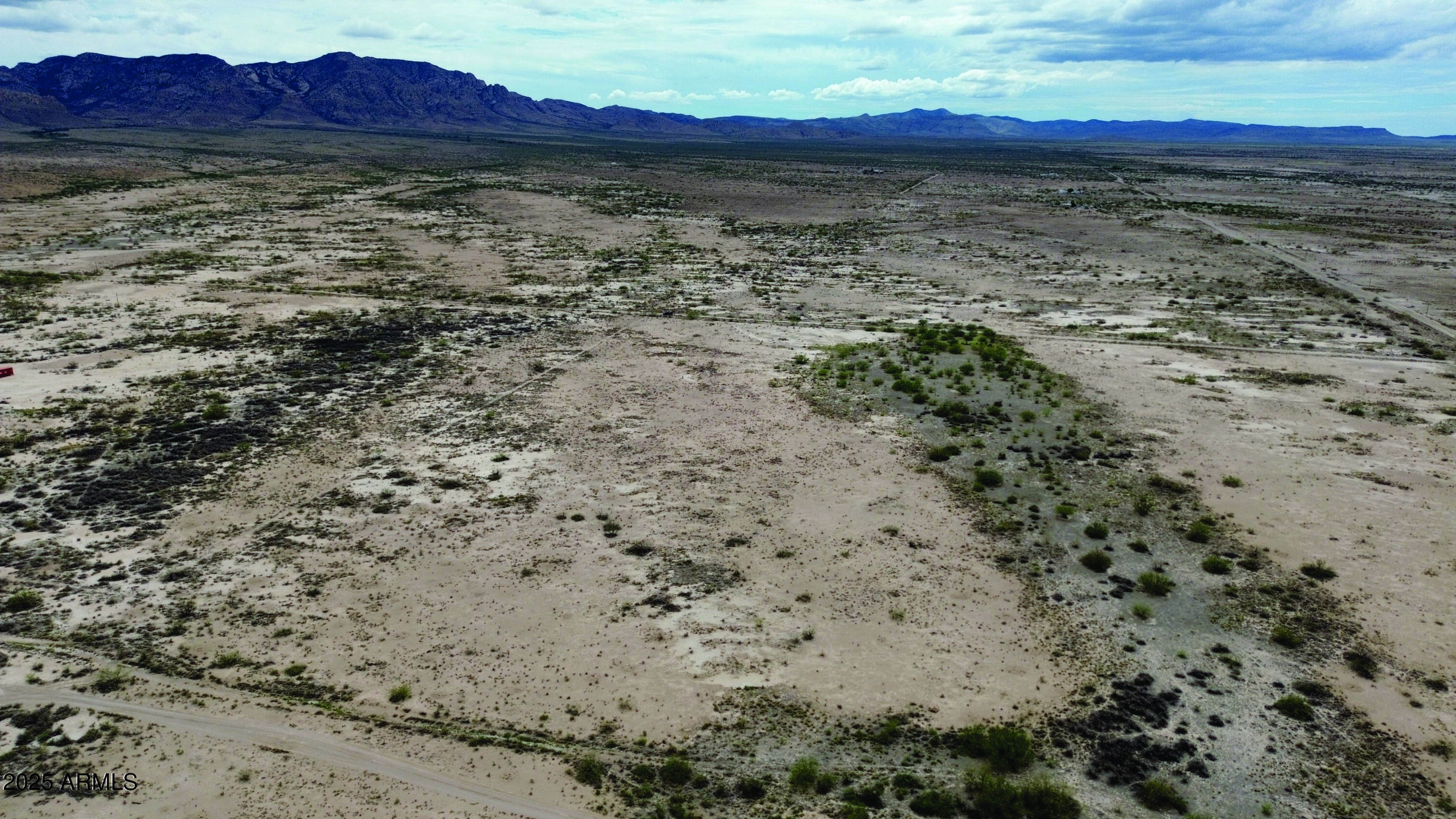 40.98-acre East Many Wells Road, Unit 32 San Simon, AZ 85632 - Photo 11 of 31 a view of lot of trees with wooden fence