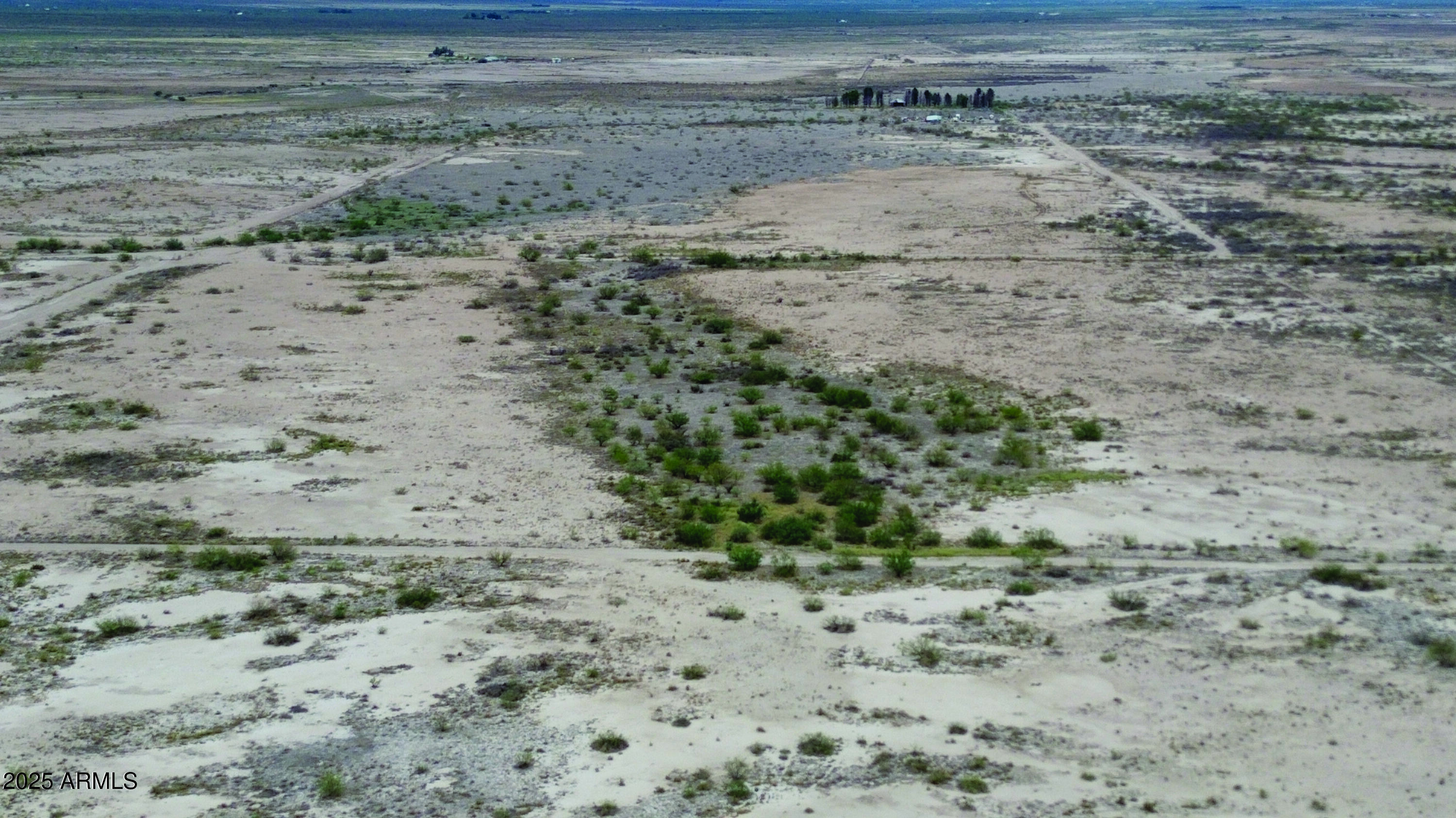40.98-acre East Many Wells Road, Unit 32 San Simon, AZ 85632 - Photo 6 of 31 a view of a dry yard with wooden floor