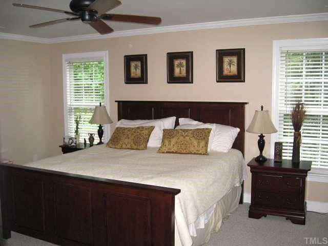 7116 Rainwater Road Raleigh, NC 27615 - Photo 8 of 12 Grand master suite with ceiling fan & walk-in closet with shelving Master Suite
