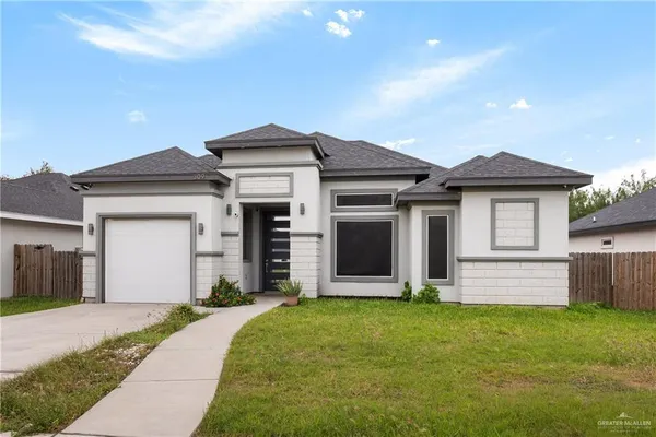 front view of a house with a yard
