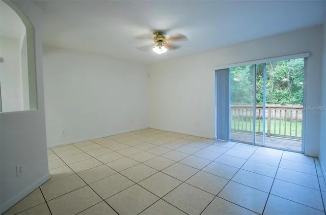 a view of an empty room and a window