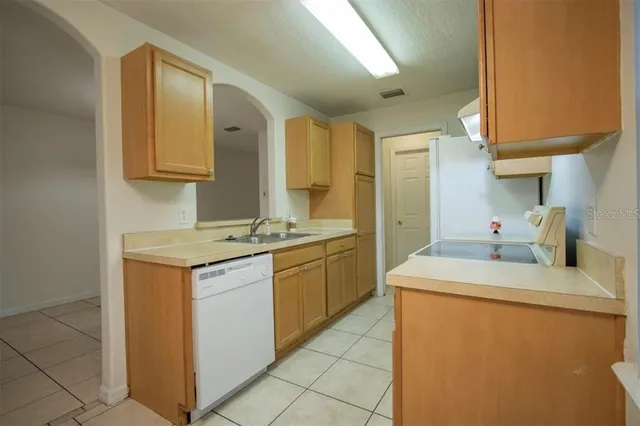 a kitchen with a sink and cabinets