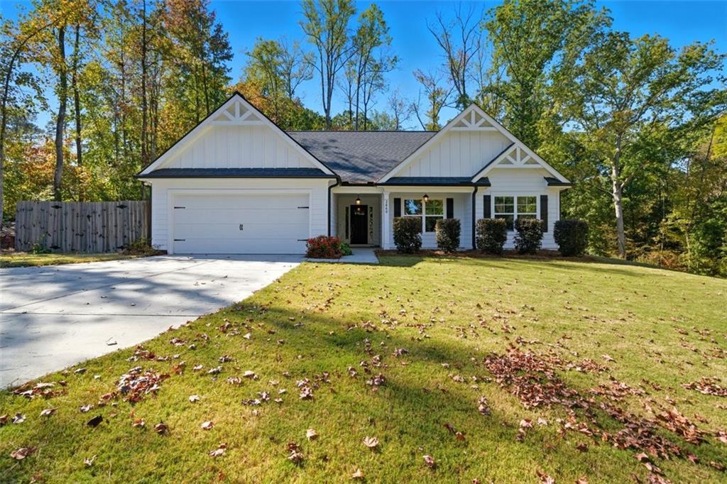 2860 Pilgrim Mill Road Cumming, GA 30041 - Photo 1 of 1 a front view of a house with a yard and trees