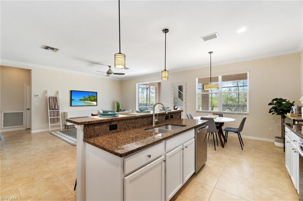 21017 Bella Terra Boulevard Estero, FL 33928 - Photo 13 of 45 a kitchen with stainless steel appliances granite countertop a stove and a sink