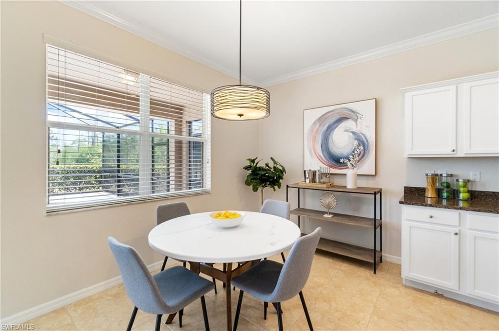 21017 Bella Terra Boulevard Estero, FL 33928 - Photo 15 of 45 a view of a dining room and chandelier