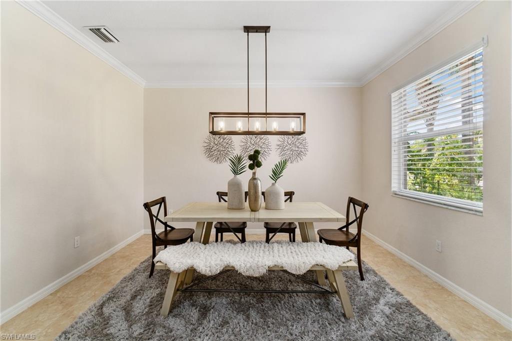 21017 Bella Terra Boulevard Estero, FL 33928 - Photo 16 of 45 a dining room with furniture and window