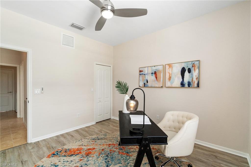 21017 Bella Terra Boulevard Estero, FL 33928 - Photo 19 of 45 a workspace room with furniture and wooden floor