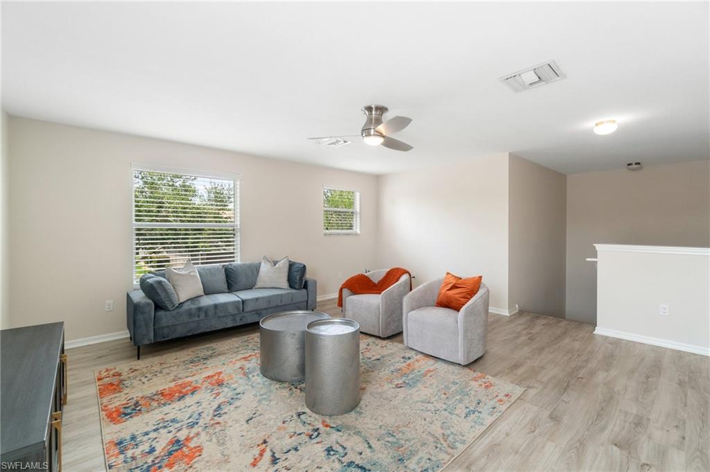 21017 Bella Terra Boulevard Estero, FL 33928 - Photo 22 of 45 a living room with furniture and a window