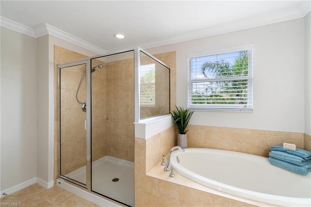 21017 Bella Terra Boulevard Estero, FL 33928 - Photo 25 of 45 a bathroom with a bathtub and a shower