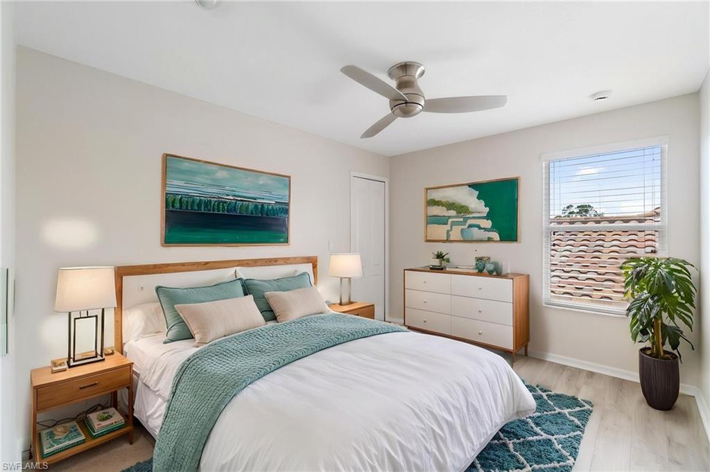 21017 Bella Terra Boulevard Estero, FL 33928 - Photo 26 of 45 a bedroom with a bed and a potted plant