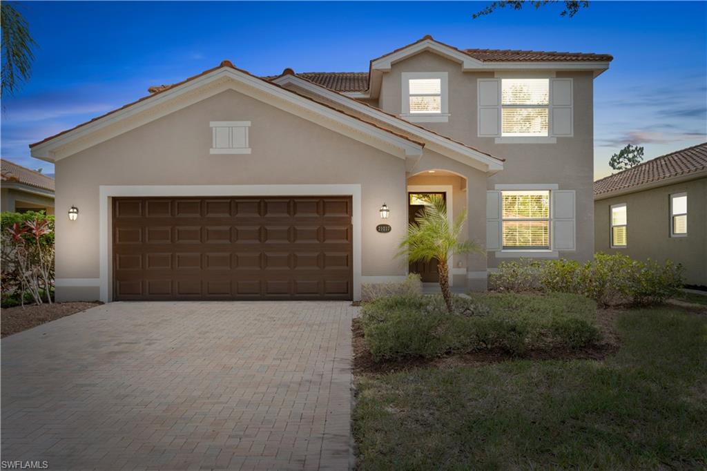 21017 Bella Terra Boulevard Estero, FL 33928 - Photo 42 of 45 a front view of a house with garden
