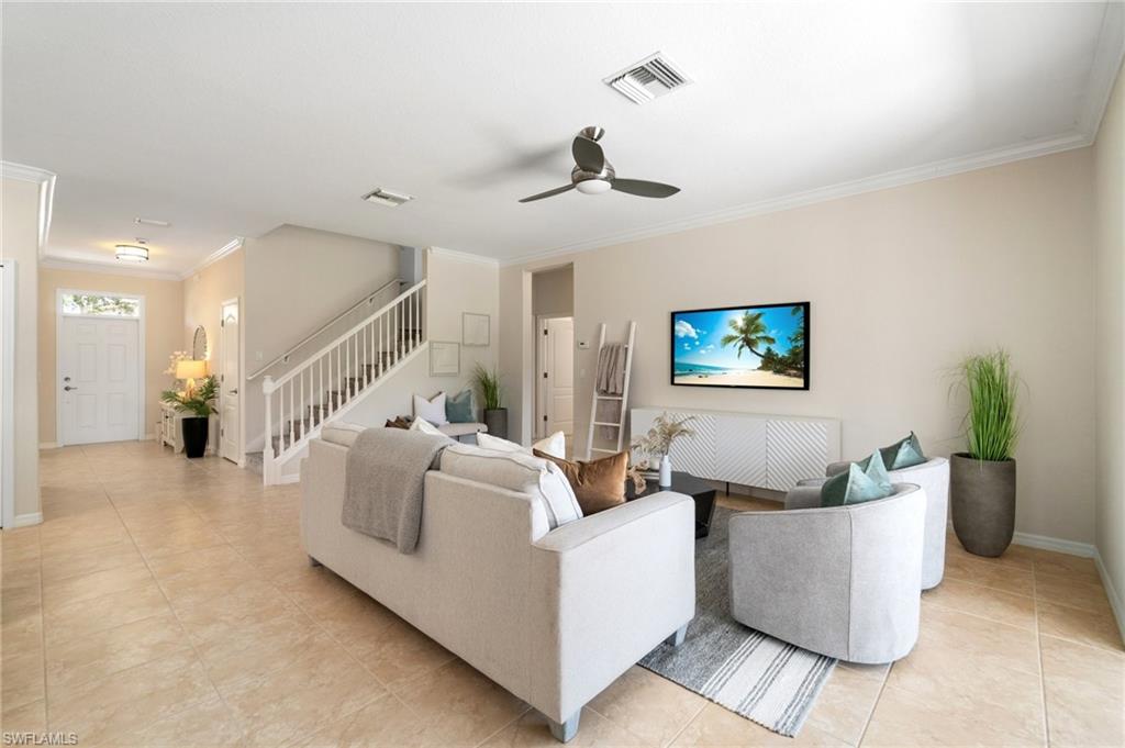 21017 Bella Terra Boulevard Estero, FL 33928 - Photo 5 of 45 a living room with furniture and a wooden floor
