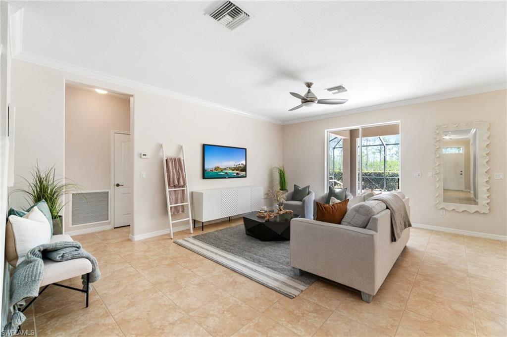 21017 Bella Terra Boulevard Estero, FL 33928 - Photo 8 of 45 a living room with furniture and a large window