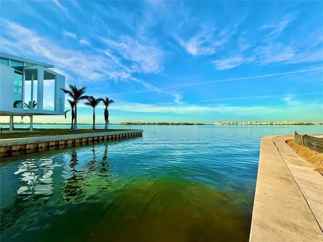 a view of a lake with a yard