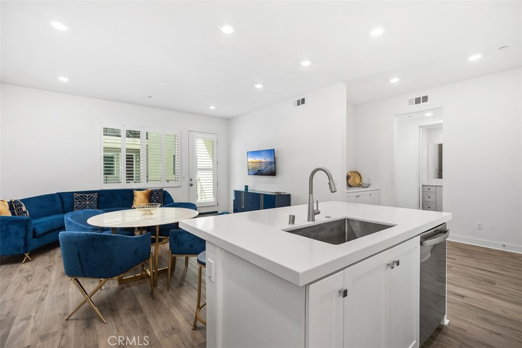 123 Sash Irvine, CA 92618 - Photo 1 of 1 a view of kitchen island a sink and living room