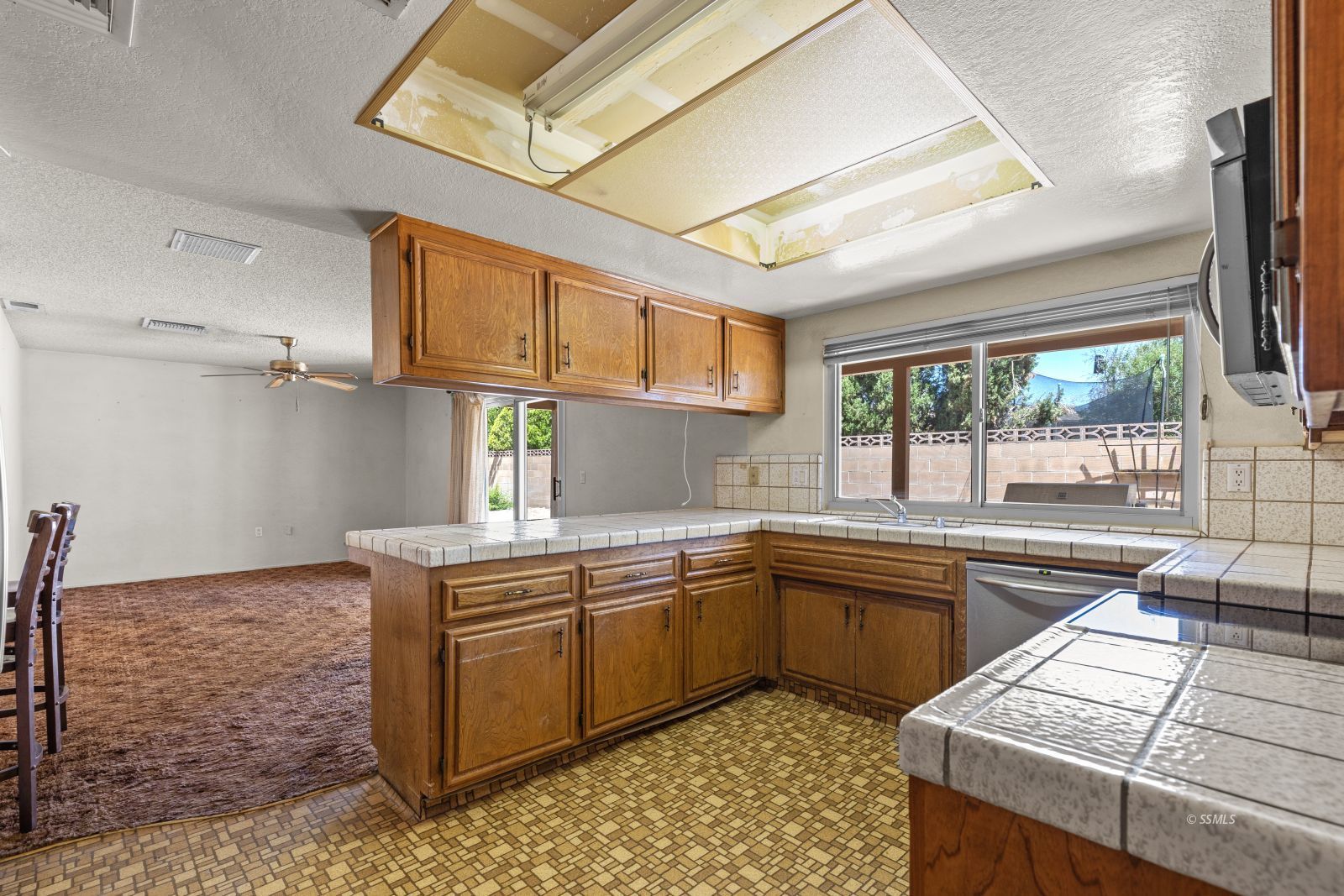 824 Kevin Way Ridgecrest, CA 93555 - Photo 14 of 38 a kitchen with a sink stove and cabinets