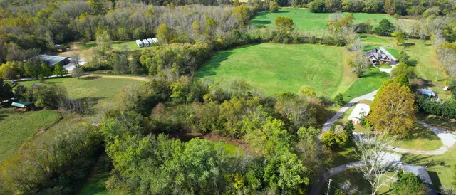 a view of a chairs and table in a patio