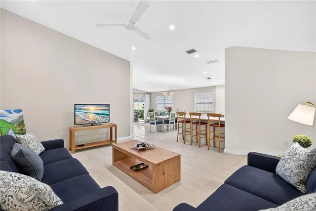 a living room with furniture and a table