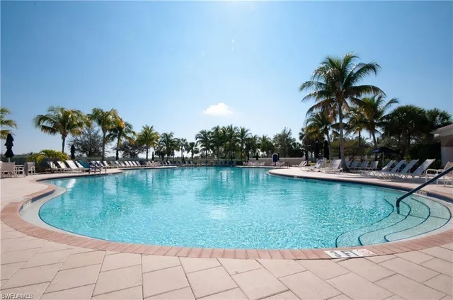 a view of a swimming pool with a patio